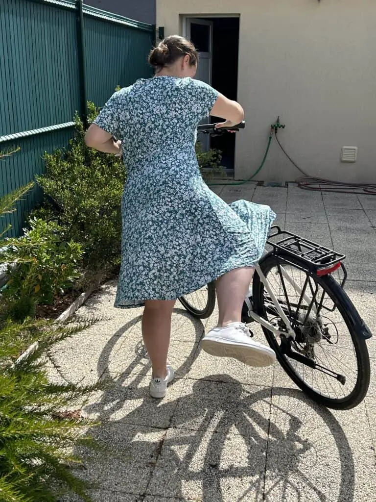 Getting off the bike with a dress
